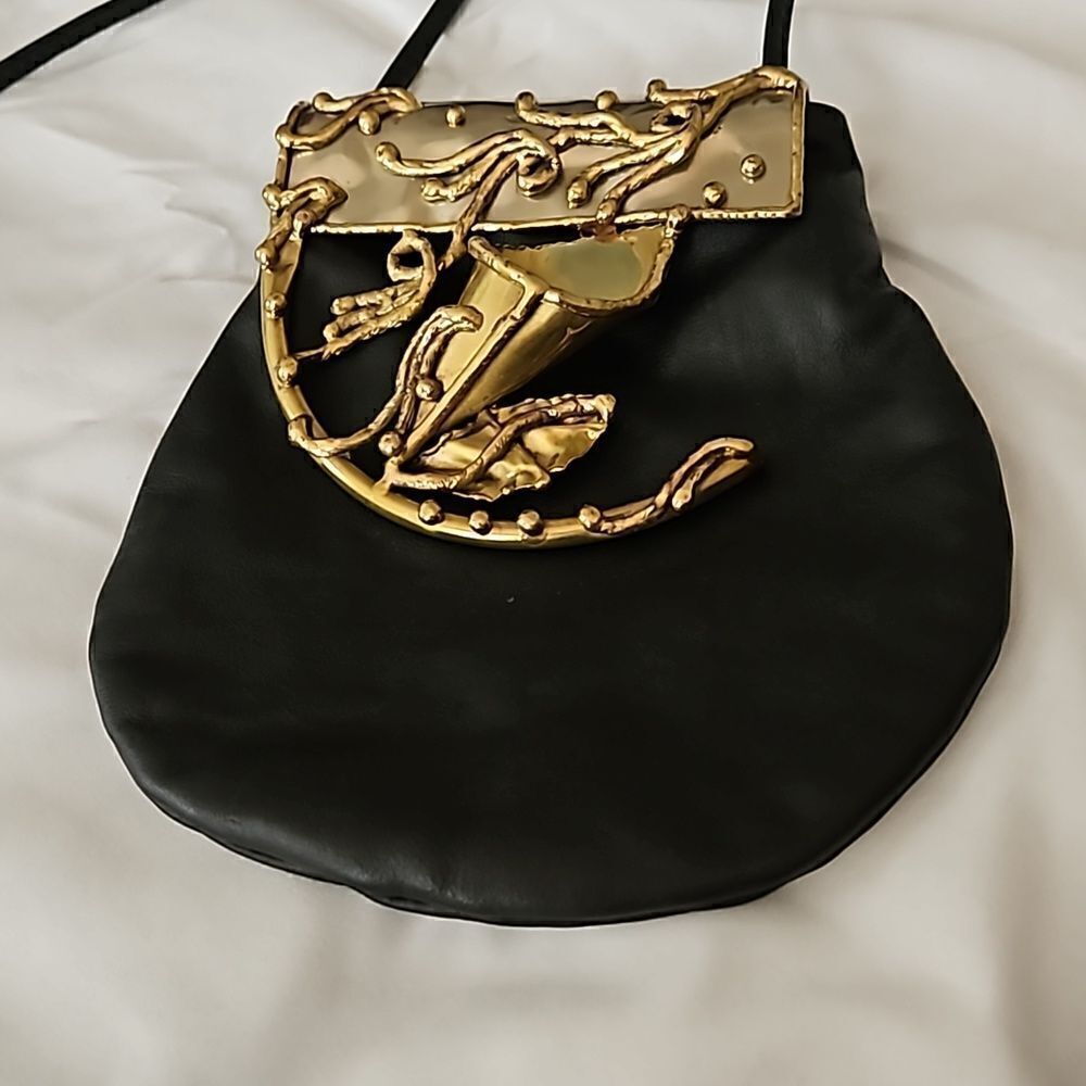 Copa Collection's vintage one of a kind crossbody black and brass handbag.